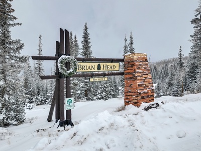 Welcome to Brian Head: A charming winter scene featuring the town's welcome sign, surrounded by snow-covered landscapes
