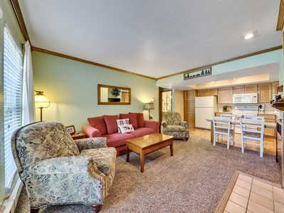 View of Living Room with queen size sleeper sofa, arm chairs, coffee table, side tables and table lamps