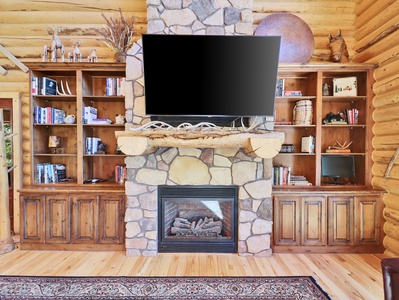 Living Room: Floor to Ceiling Stone Fire Place and Smart TV