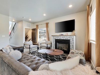 View of Great Room, Ample Seating, Gas Fireplace, 64" Smart TV