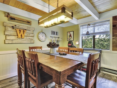 View of Dining Room including dining table with seating for six, modern chandelier