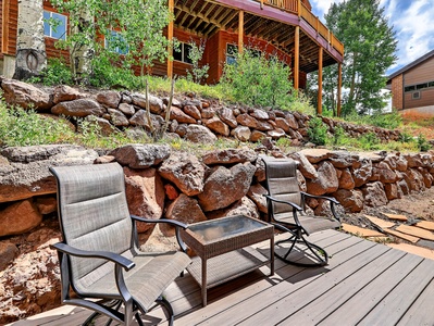 Outdoor seating area with beautiful views of the mountains and surrounding trees