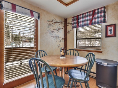 View of the dining area with seating for four, ideal for enjoying meals or gathering together
