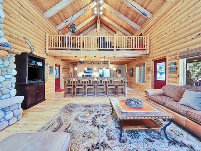 Living Room, Kitchen and Loft, with Floor to Ceiling Gas, and Kitchen Island with Counter Seating for 6