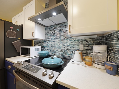 View of the galley kitchen with all the appliances necessary to enjoy a home cooked meal