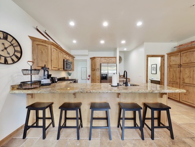 View of Gourmet Kitchen with Kitchen Aid Appliances, Granite Counter Top with Seating for 5