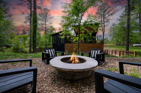 The fire pit area - accessed via a bridge over a creek - is set apart and creates a special moment to enjoy!