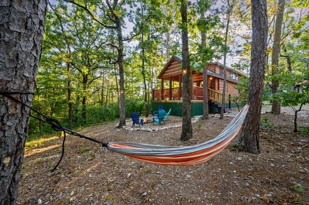 Idyllic log cabin feel with a fire pit that backs up to the national forest