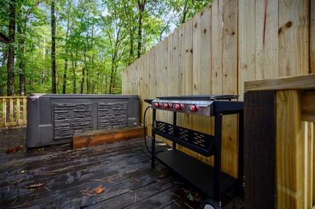 Fire up the grill on the deck and enjoy the convenience of an outdoor cooking station right next to your hot tub for ultimate relaxation.