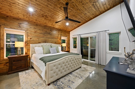 A wooded king ensuite room brings the feeling of the outside in. Enjoy the plush king bed!