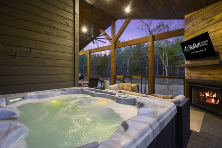 Soak in your private hot tub on the back deck with wooded views, or kick on the game on the outdoor TV.