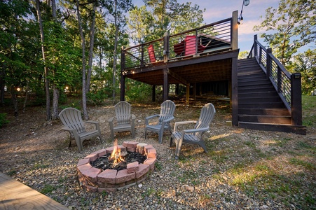 Enjoy an evening around the fire pit with adirondack chairs.