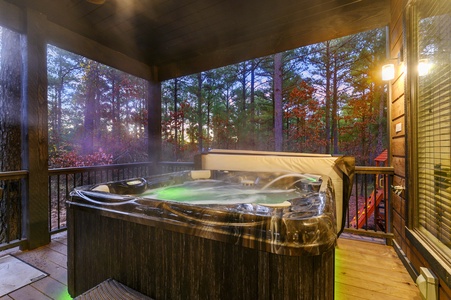 Hot tub on lower level patio with view of the trees