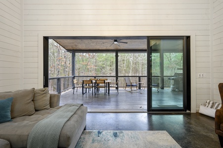 The living room opens out to a spaceous outdor living area.