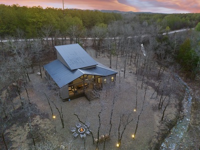 Welcome to Wine Down! A beautiful custom cabin surrounded by trees and a private creek!