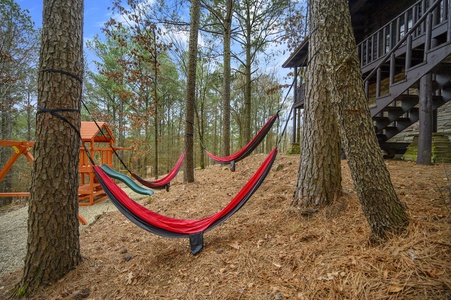 Relax in the outdoor hammocks hung among the trees.