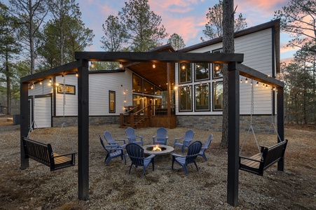 Make fireside memories with custom swings and views of your modern cabin and pine trees