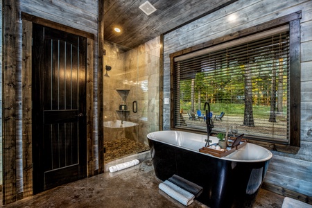 This picture is in the master bedroom and shows the very elegant soaker tub and the walk-in shower in the background.