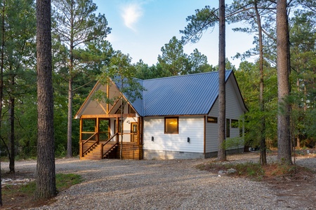 The cabin sits on a 1 acre lot, set back off the road with a circle drive that's convenient for navigating when hauling your boat or ATV's.