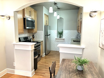 Kitchen area with sink, fridge and stove