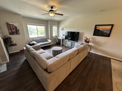 Living room with queen sleeper sofa and TV