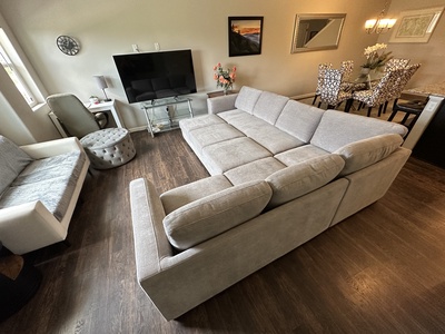 Living room with queen sleeper sofa unfolded