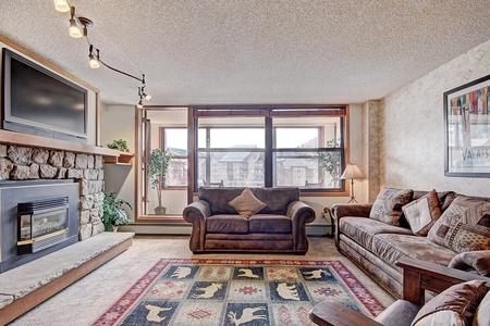 Cozy living room featuring large windows