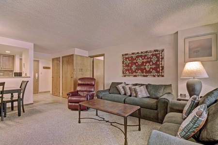 Cozy living room featuring a couch that pulls out to a queen sized sleeper sofa