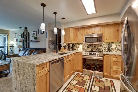 Open concept kitchen and living areas.