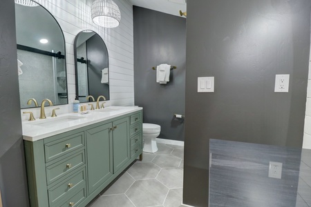 Beautifully updated bathrooms with double vanity sinks.