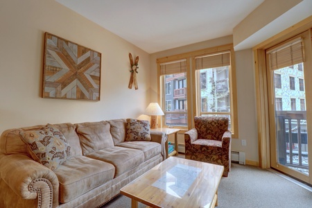 Living room features a queen sleeper sofa.