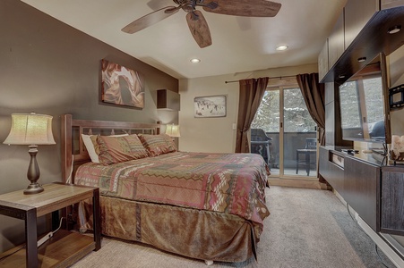 Bedroom on main level featuring private deck and attached bath.