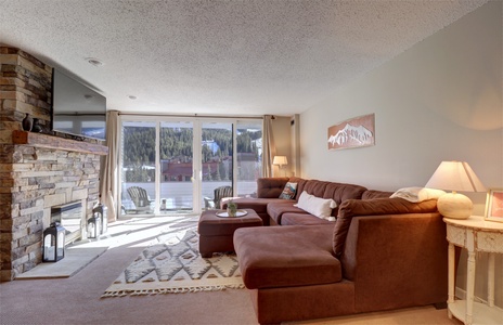 Large comfy couch with views out onto the mountain.