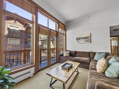 Nice living area with large windows bringing in plenty of natural light.