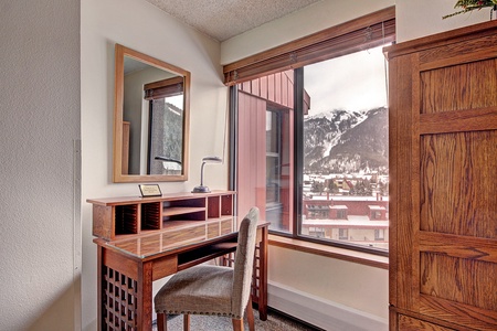 Desk seating area near window, with great mountain views.