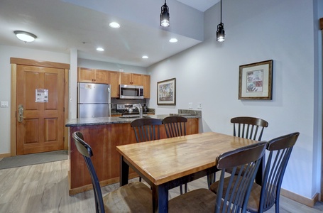 Dining room table looking into kitchen.