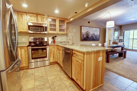 Kitchen area featuring island bar seating.