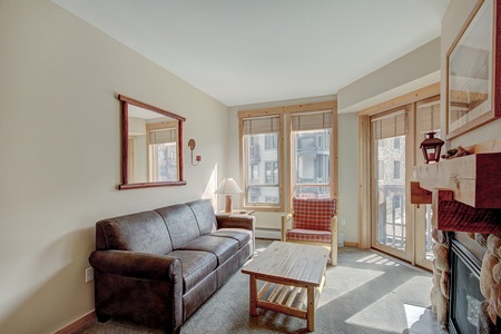 Living room features a queen sleeper sofa couch.