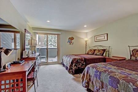 The hotel room features 2 queen beds.