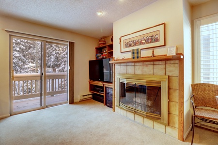 This cozy unit features a gas fireplace and large TV.