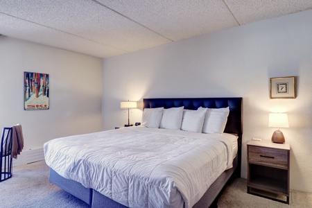 Hotel room featuring a cozy bed