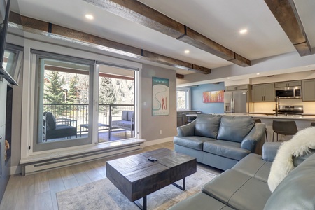 Nicely updated living area looking out to private balcony.