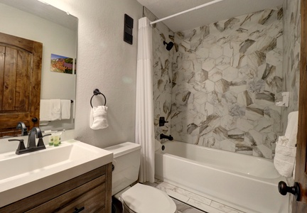 Nicely updated bathroom with shower/tub combo.