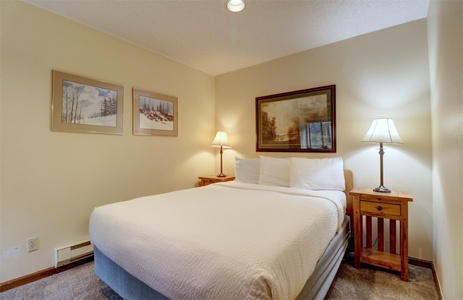 A hotel room featuring queen bed.