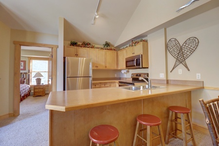 Kitchen features bar stool seating area