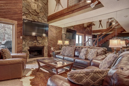 Cozy seating options on main level with fireplace.