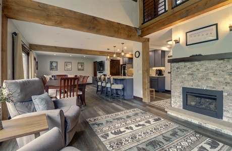 Living room features a cozy fireplace area