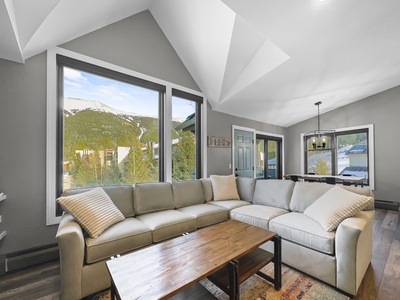 Bright modern living room features a large sleeper sofa sectional.