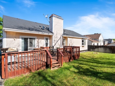Fenced Backyard with deck and grill