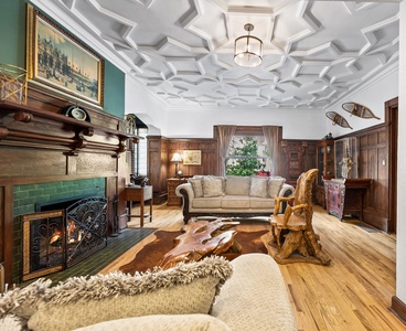 This warm and inviting living space blends historic character with cozy comfort.
